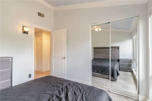 a bedroom with a bed and a walk in closet