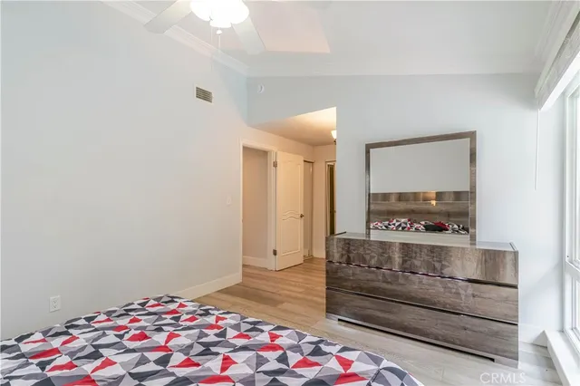 a bedroom with a bed and a lamp