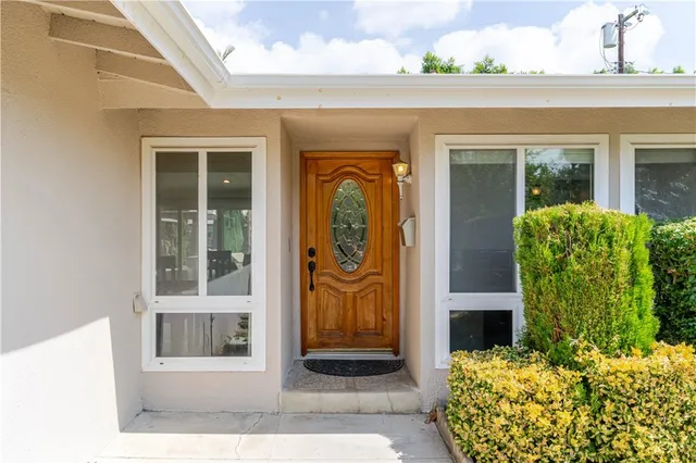 a view of a house with a yard and garage