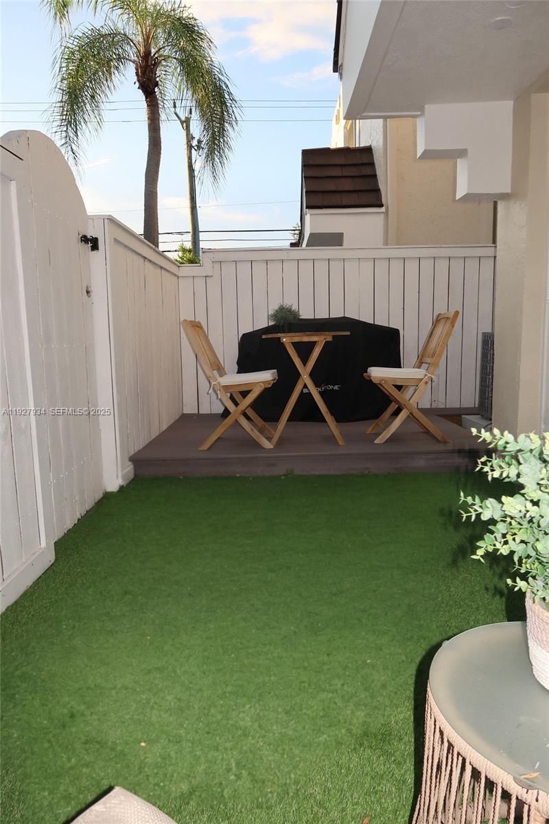 4530 Southwest 68th Ct Circle, Unit 356 Miami, FL 33155 - Photo 14 of 31 a view of a backyard with a garden and plants