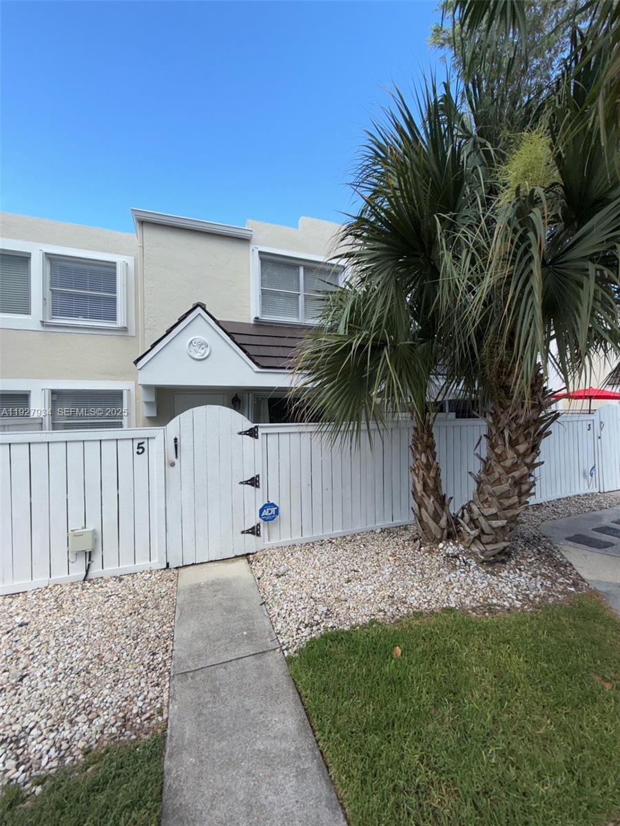4530 Southwest 68th Ct Circle, Unit 356 Miami, FL 33155 - Photo 18 of 31 a view of a house with a yard and plant