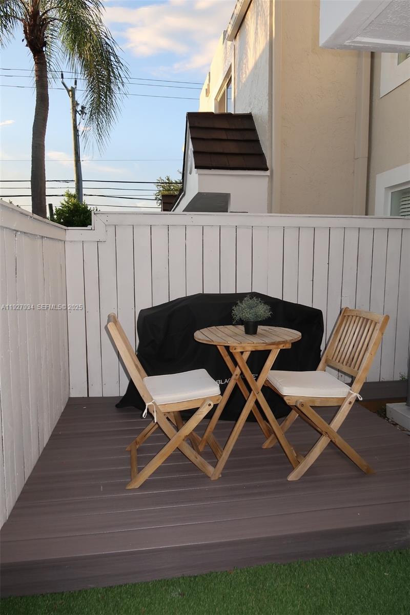 4530 Southwest 68th Ct Circle, Unit 356 Miami, FL 33155 - Photo 21 of 31 a lawn chairs sitting in a backyard of a house
