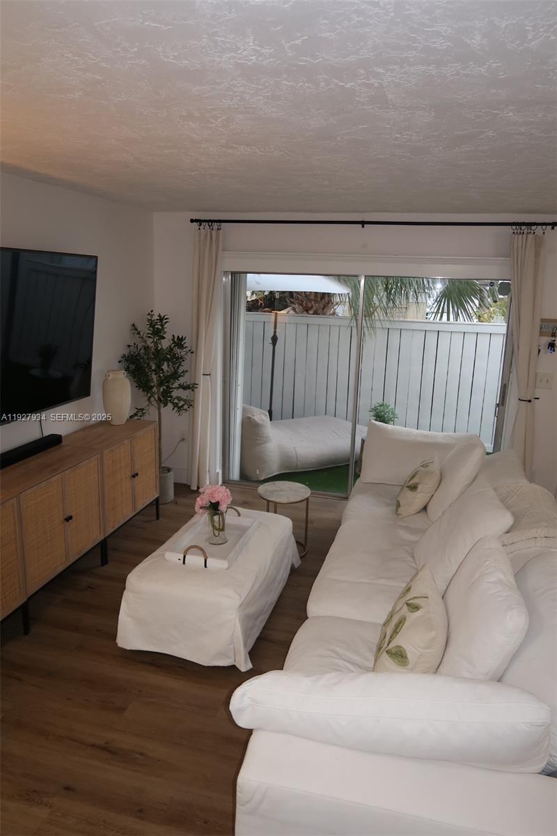 4530 Southwest 68th Ct Circle, Unit 356 Miami, FL 33155 - Photo 10 of 31 a living room with furniture and a flat screen tv