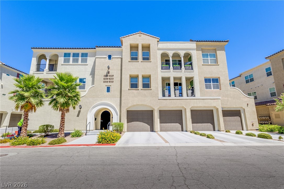 Mediterranean-inspired facade with multiple balconies and integrated garages.