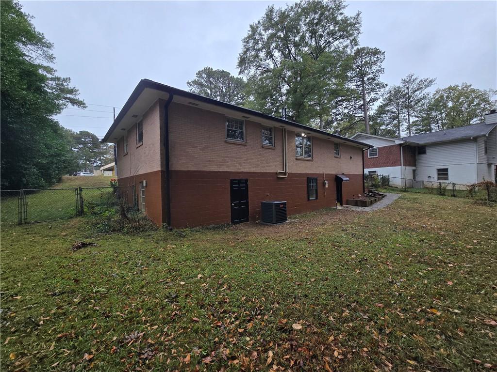 2468 Dresden Drive Northeast Atlanta, GA 30341 - Photo 25 of 26 a backyard of a house with barbeque oven and outdoor seating