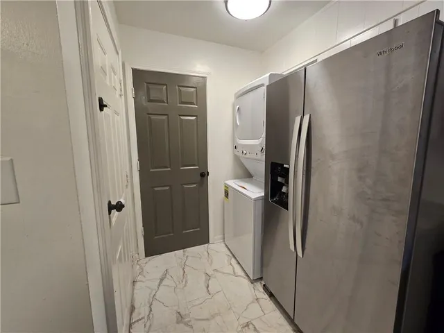 a bathroom with a shower and a glass door