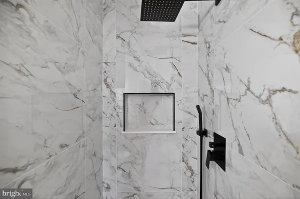 a stone wall with a shower