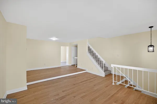 a view of an empty room with stairs