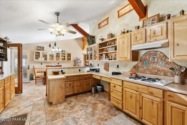 a bathroom with a sink a mirror and a window