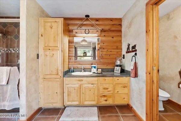 a utility room with sink dryer and washer
