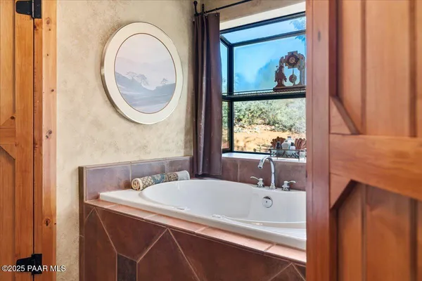 a view of living room with a sink and cabinets