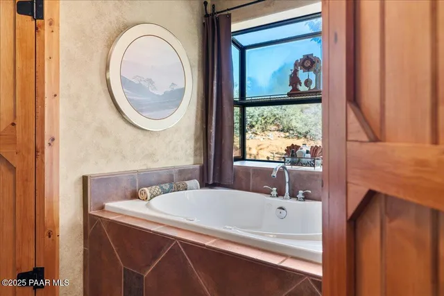 a view of living room with a sink and cabinets