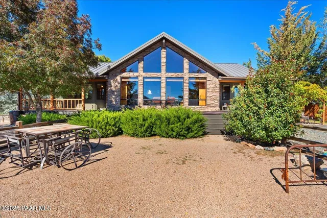 a view of swimming pool outdoor seating and trees