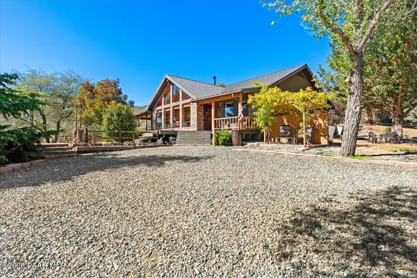 a view of a porch and wooden floor