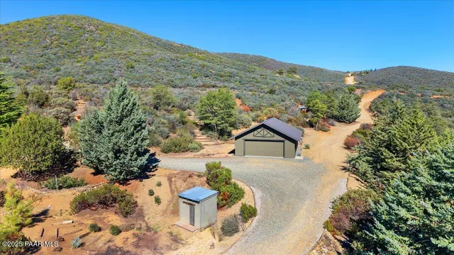 a view of mountain with a forest