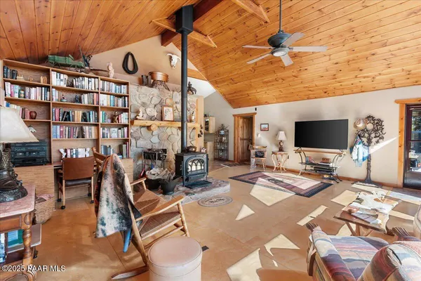 a kitchen with stainless steel appliances kitchen island granite countertop a sink and cabinets