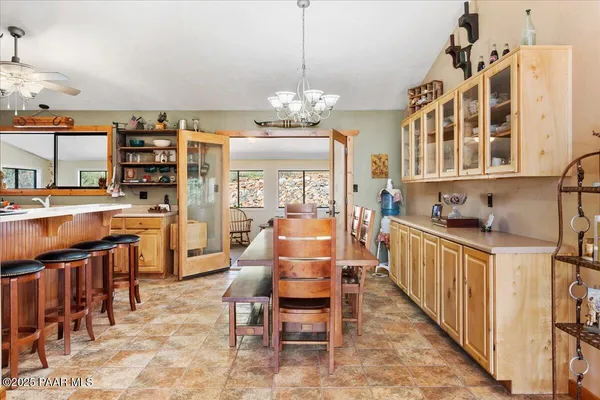 a kitchen with stainless steel appliances a stove a sink and cabinets