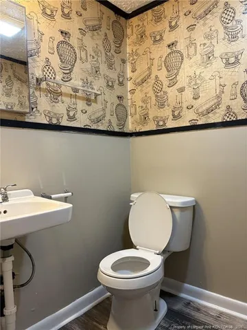a bathroom with a toilet and a sink