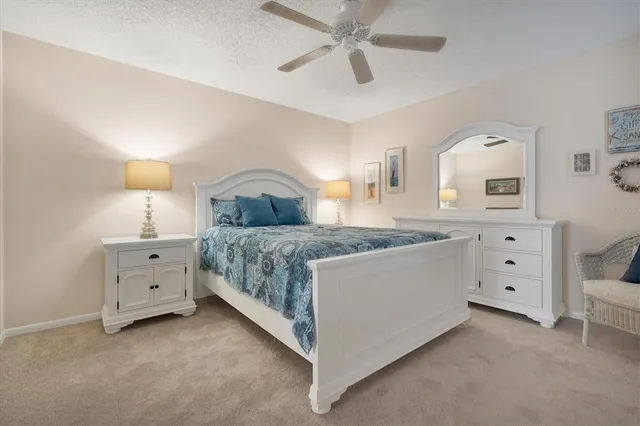 a room with a bed and a dresser