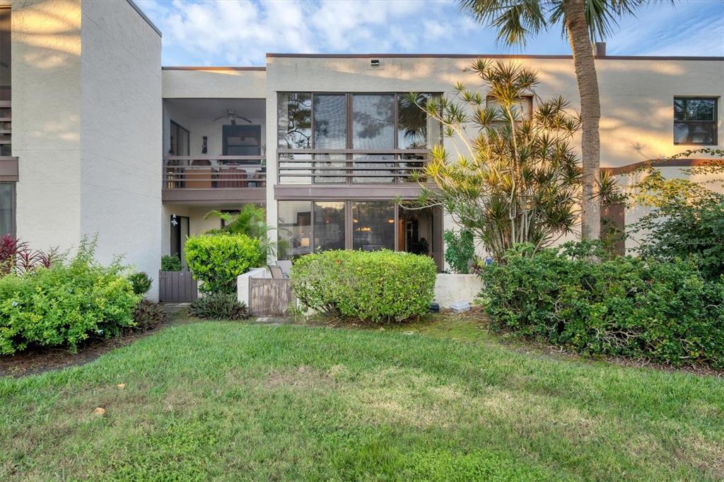 5032 Marsh Field Road, Unit 19 Sarasota, FL 34235 - Photo 26 of 30 front view of a house with a yard