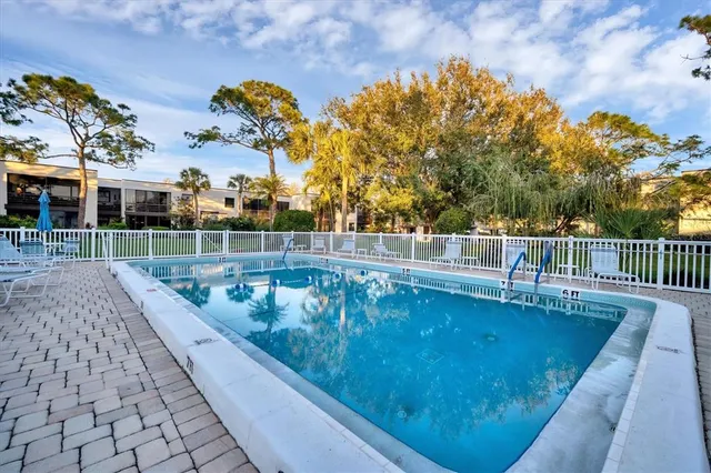 a view of swimming pool with seating space