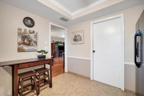 a view of a livingroom with furniture and a window