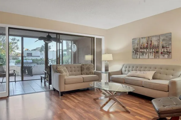 a living room with furniture and a large window