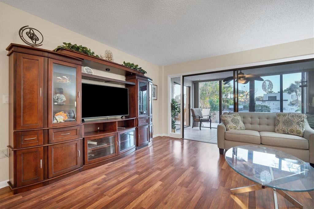 5032 Marsh Field Road, Unit 19 Sarasota, FL 34235 - Photo 7 of 30 a living room with furniture and a flat screen tv