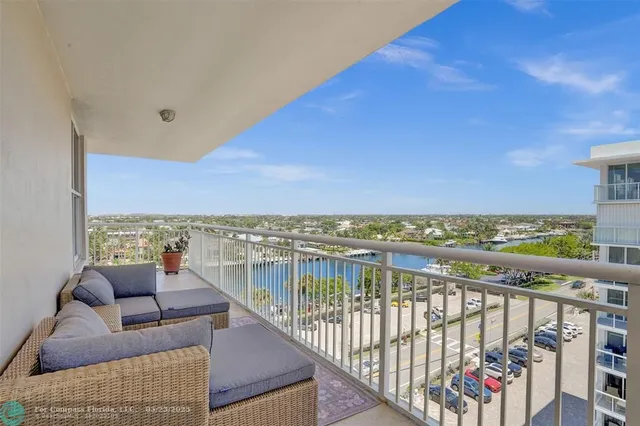 a view of roof deck with furniture