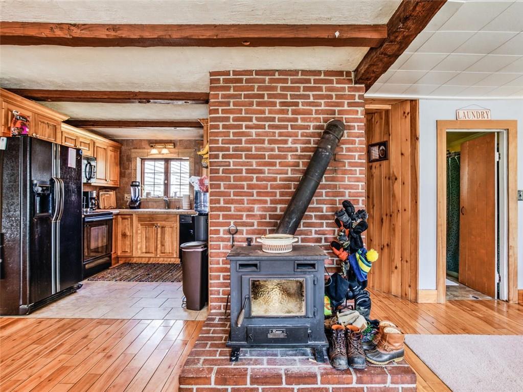 548 Howes Corner Road Turner, ME 04282 - Photo 8 of 30 Woodstove in dining/living room area.