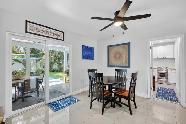 a dining room with furniture and window
