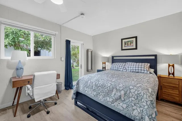 a bedroom with a bed and a desk