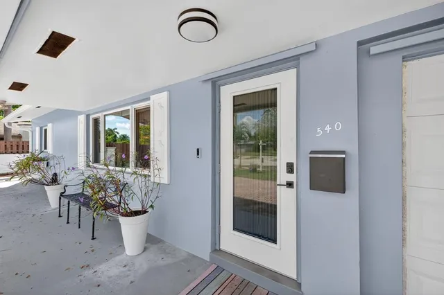 a view of a living room and bathroom