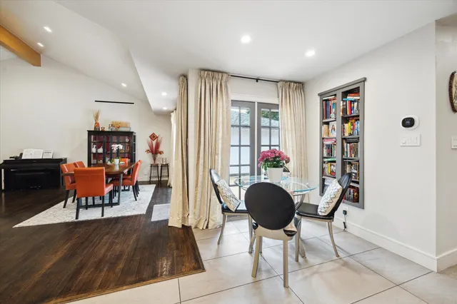 a living room with furniture and a book shelf
