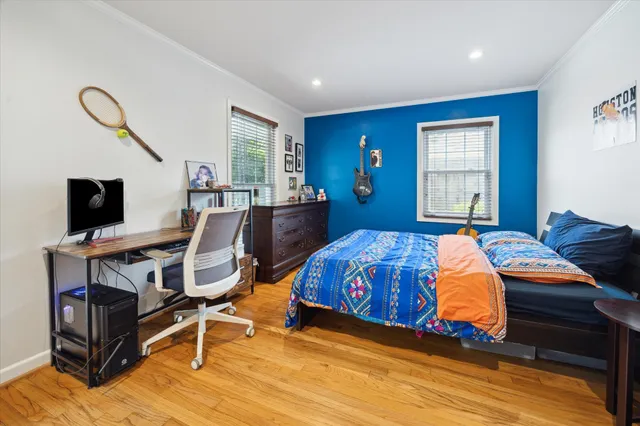 a bedroom with furniture and a window