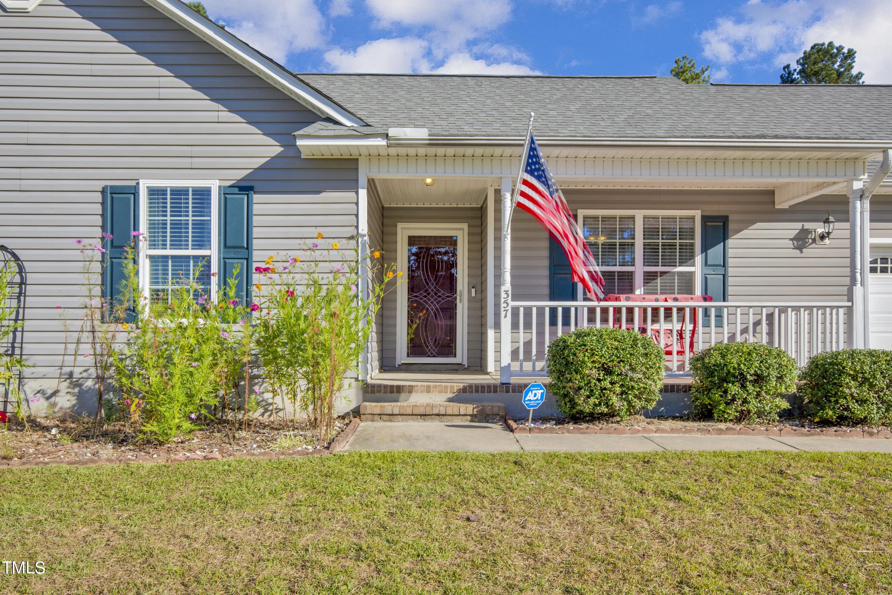357 Smokey Mountain Drive Raeford, NC 28376 - Photo 1 of 25 a front view of a house with a yard