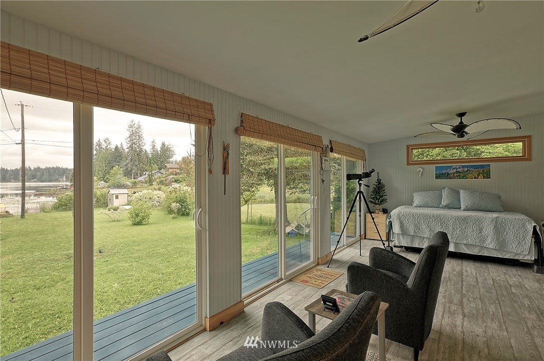 18812 Lerch Road Snohomish, WA 98290 - Photo 21 of 35 a living room with furniture and a floor to ceiling window