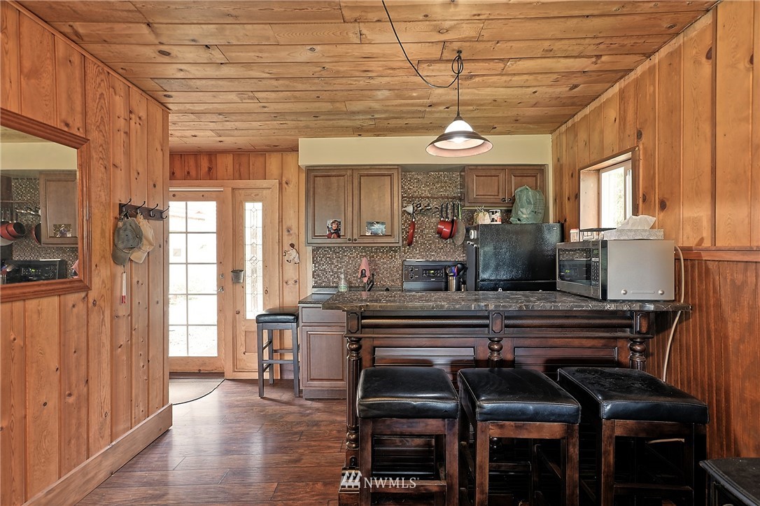 18812 Lerch Road Snohomish, WA 98290 - Photo 22 of 35 a view of a dining room with furniture window and wooden floor