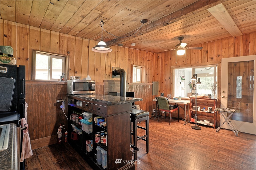 18812 Lerch Road Snohomish, WA 98290 - Photo 24 of 35 a view of a dining room with furniture window and wooden floor