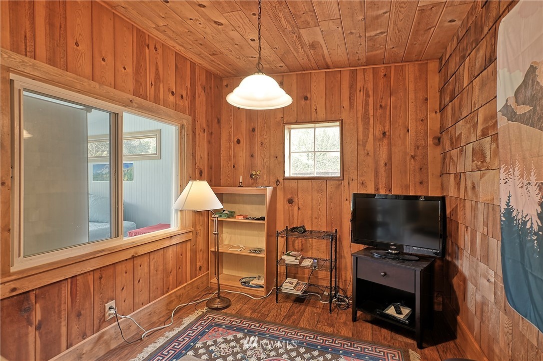 18812 Lerch Road Snohomish, WA 98290 - Photo 25 of 35 a living room with furniture a flat screen tv and a window