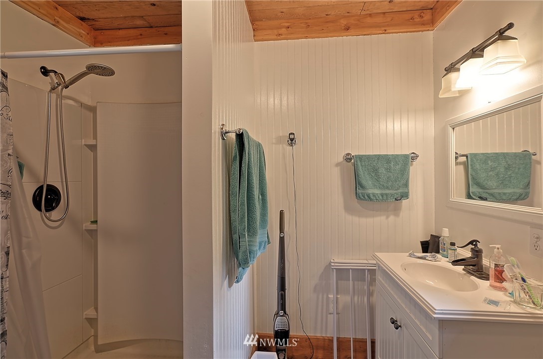 18812 Lerch Road Snohomish, WA 98290 - Photo 28 of 35 a bathroom with a sink vanity and mirror
