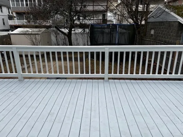 a balcony with wooden floor