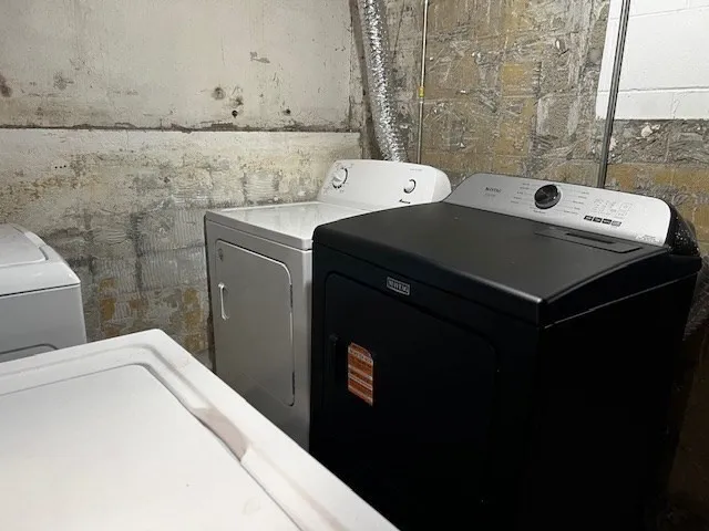 a utility room with a sink a washer and dryer