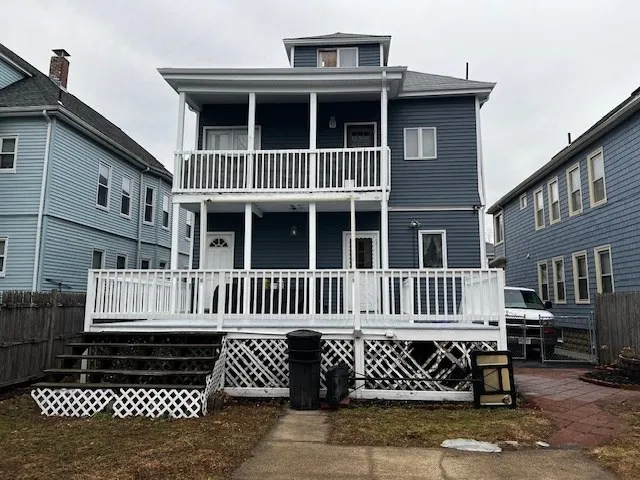 a view of a house with a bench