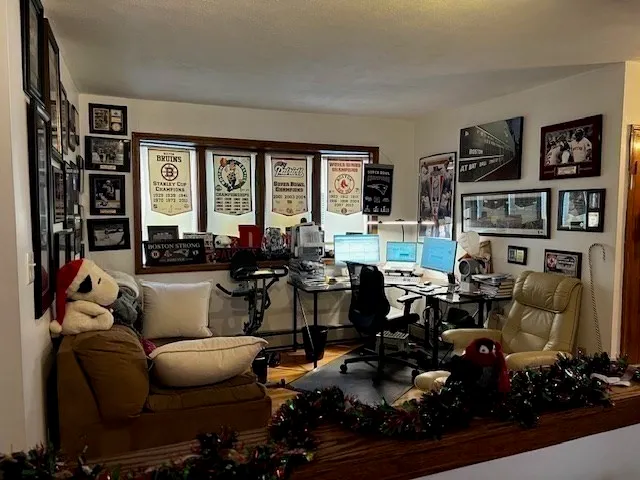 a living room with furniture and floor to ceiling windows