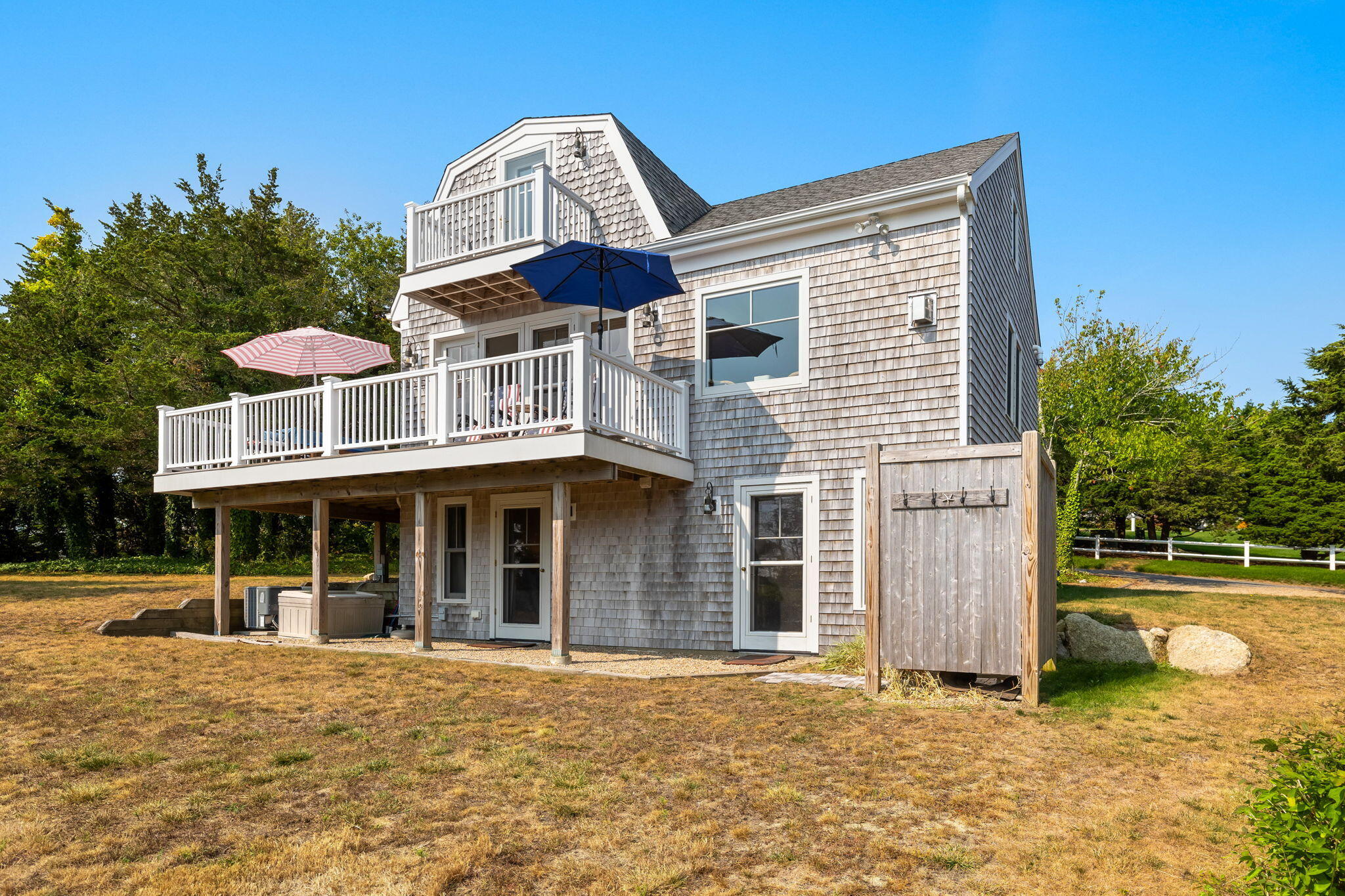 63 Briar Spring Road Orleans, MA 02653 - Photo 24 of 37 a front view of a house with a garden