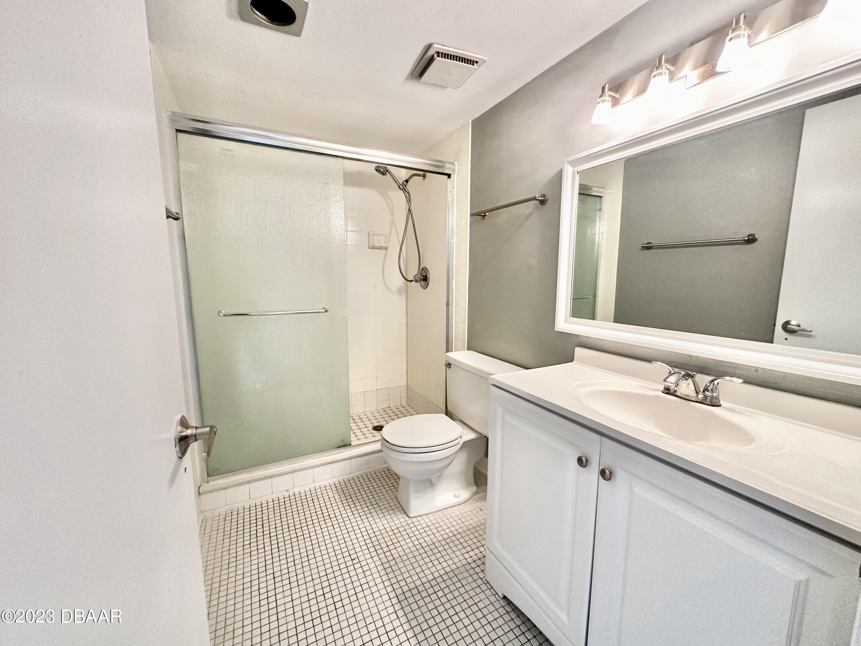 4790 South Atlantic Avenue, Unit D403 Ponce Inlet, FL 32127 - Photo 18 of 27 a bathroom with a sink a toilet and shower