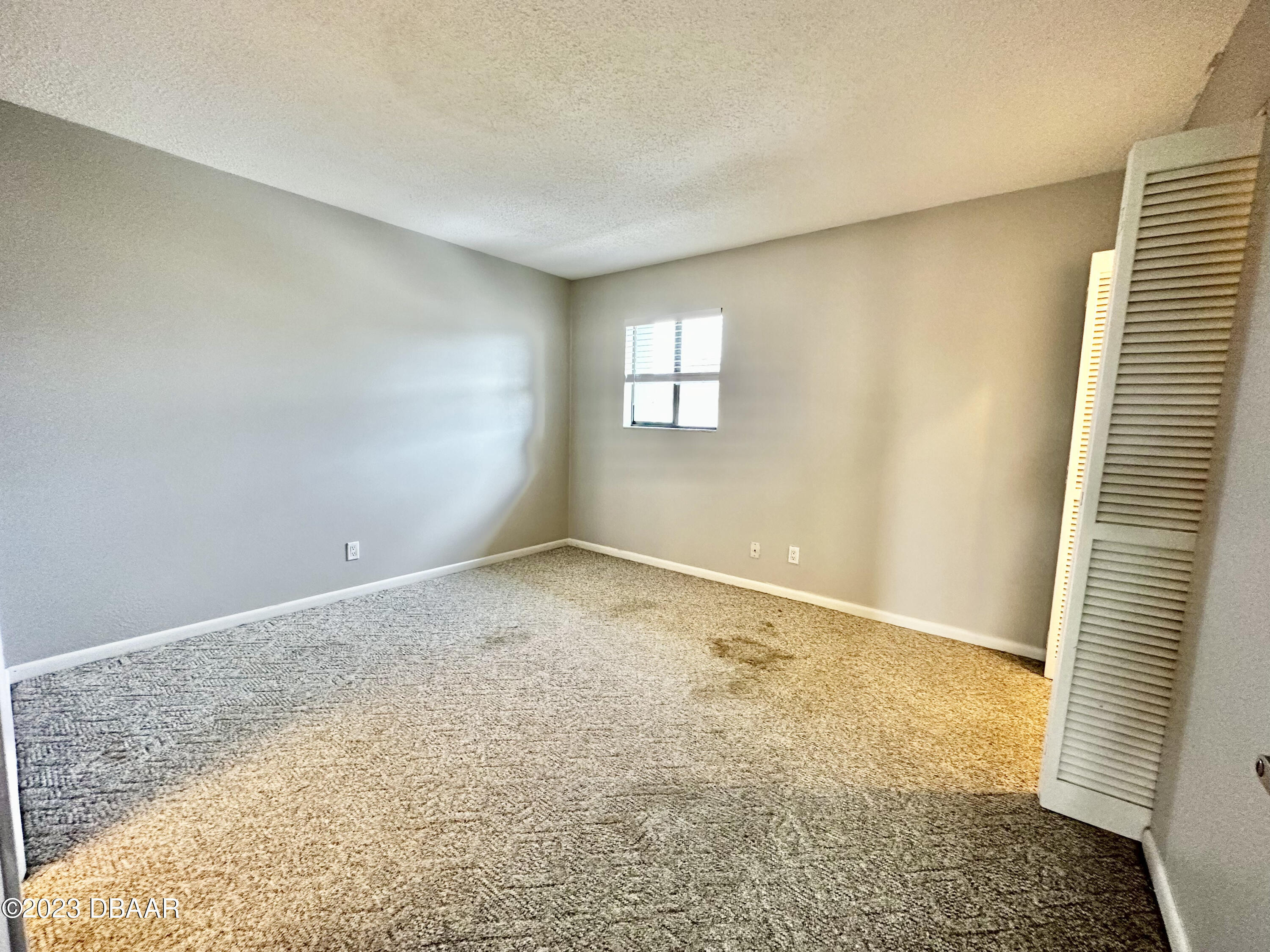 4790 South Atlantic Avenue, Unit D403 Ponce Inlet, FL 32127 - Photo 20 of 27 an empty room with a natural light