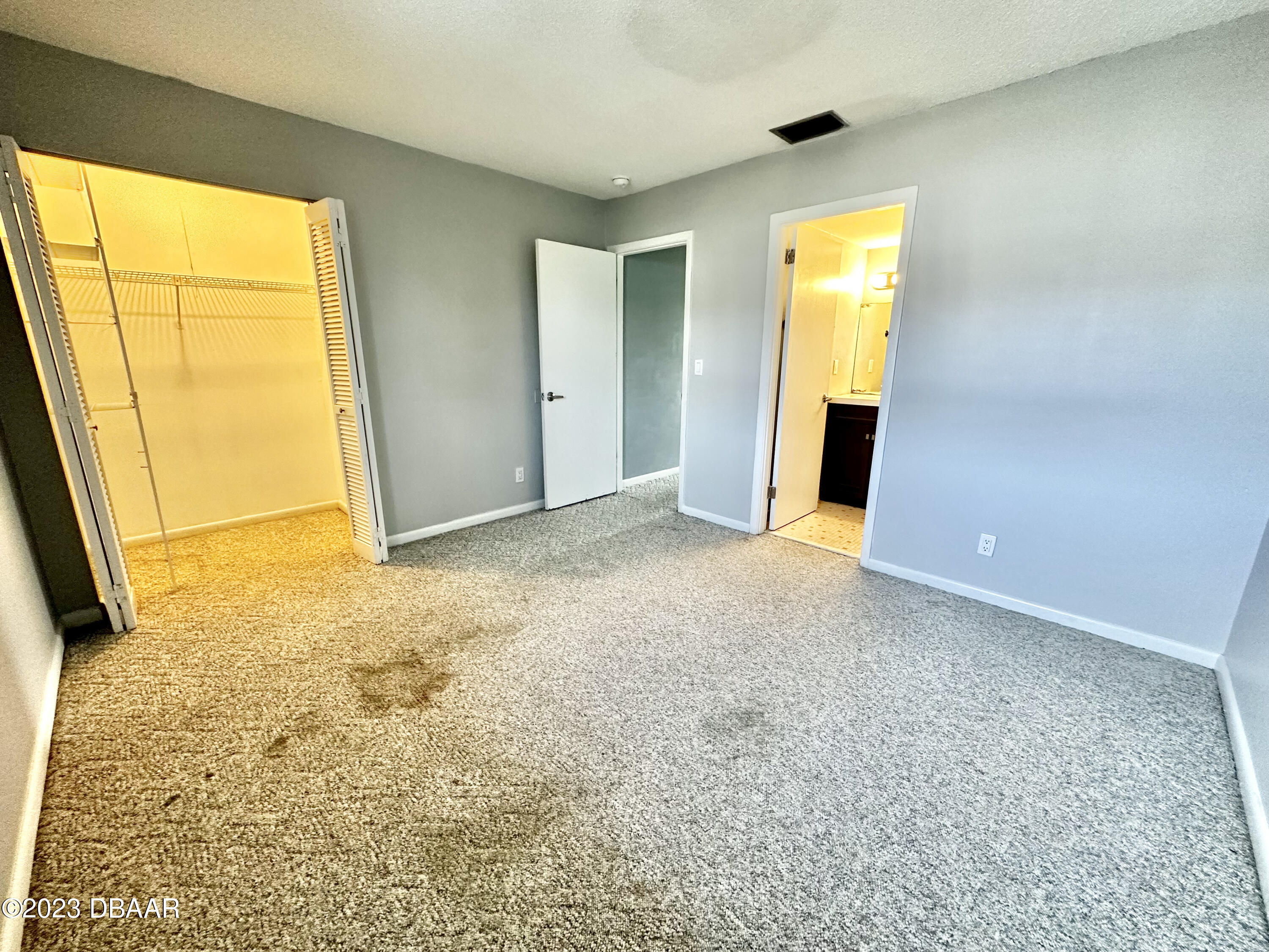 4790 South Atlantic Avenue, Unit D403 Ponce Inlet, FL 32127 - Photo 21 of 27 a view of an empty room with a window