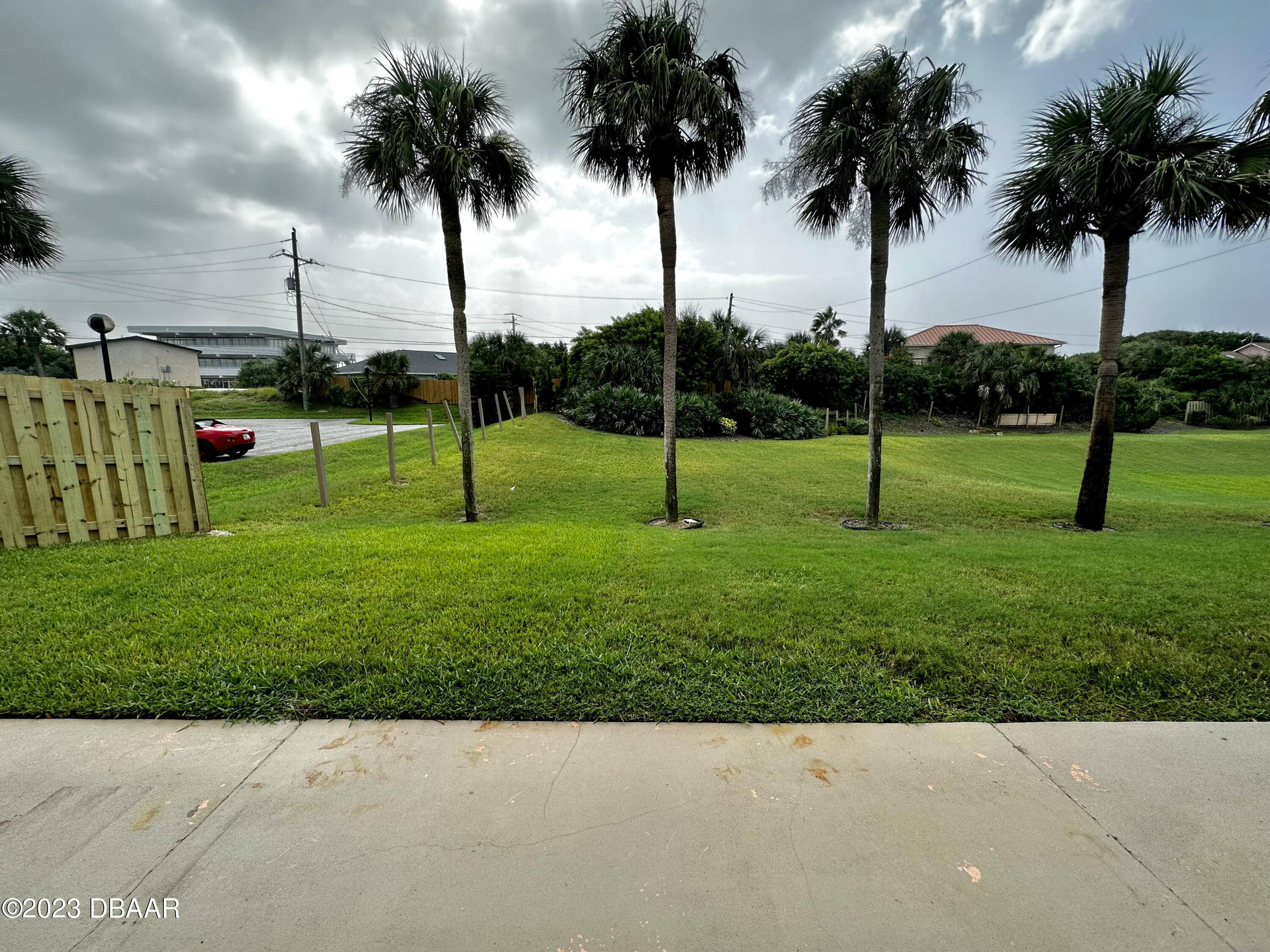 4790 South Atlantic Avenue, Unit D403 Ponce Inlet, FL 32127 - Photo 24 of 27 a view of yard with palm trees